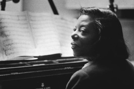 Mary Lou Williams sitting at the piano